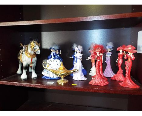 A collection of figurines from the Thomas Kinkade collection, and the Blue Willow lady collection, ceramic shire horse and a 