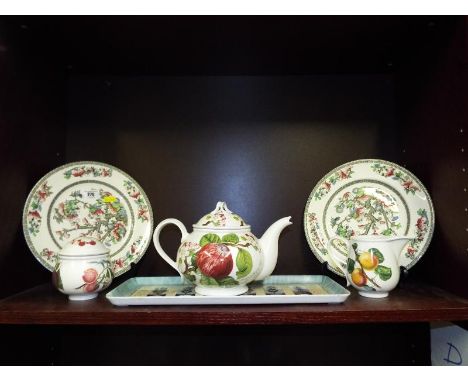 A mixed lot of ceramic tableware to include a pair of Johnson Bros Indian Tree plates and Portmeirion tableware in the Pomona
