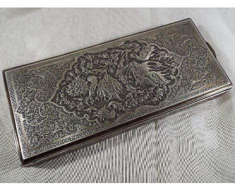 An Eastern silver hinge lidded trinket with intricate relief decoration depicting exotic birds within a panel surrounded by f