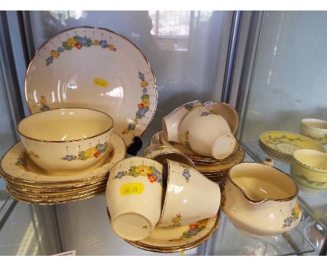 A collection of approximately 25 pieces of Alfred Meakin ceramic table ware