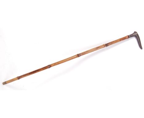 A beautiful antique 19th century walking sword stick. Bamboo shaft, with cast iron shaped handle and small inset silver band 