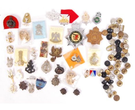 A large collection of assorted military (and other) cap badges, buttons, and related items. To include; an Avon &amp; Somerse