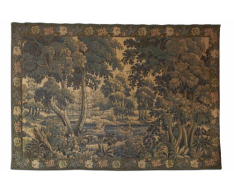 MACHINE WOVEN VERDURE TAPESTRY in the 17th century style, depicting a pair of geese on a river in a wooded landscape, within 