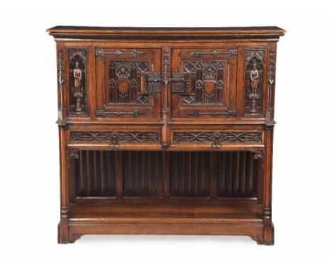 FRENCH GOTHIC STYLE OAK AUMBRY  LATE 19TH CENTURY  the plain top with a moulded cornice above a pair of doors with carved Got