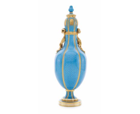 MINTONS PORCELAIN COVERED VASE  MID 19TH CENTURY  with an ogee finial above the garlic-mouth lobed body and applied ribbon de