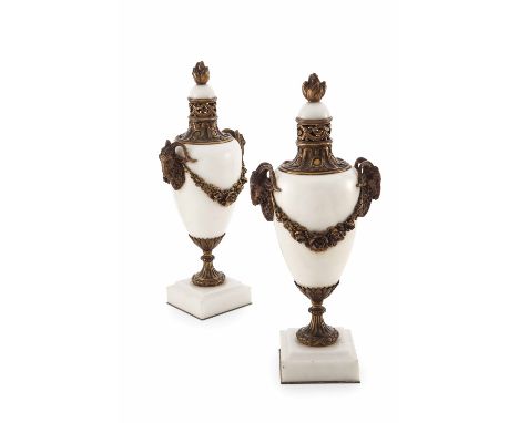 PAIR OF FRENCH GILT BRONZE MOUNTED MARBLE URNS  19TH CENTURY  each with a flame finial above the white marble body and pierce