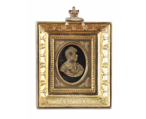 GILT BRASS RELIEF PROFILE PORTRAIT OF GEORGE IV  19TH CENTURY  mounted on a black oval ground, in a gilt and gesso slip and m