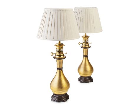 PAIR OF FRENCH MODERATEUR PATINATED AND GILT METAL LAMPS  ADAPTED, 19TH CENTURY AND LATER  each converted from an oil lamp, o