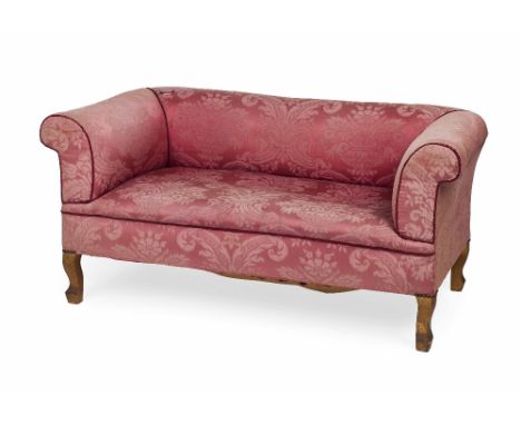 EDWARDIAN SMALL WALNUT FRAMED SOFA  EARLY 20TH CENTURY  the low back and high scrolled arms above a stuff over seat, in pink 