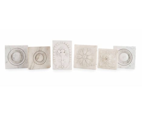 SIX WHITE CARVED MARBLE FIRE SURROUND ELEMENTS  18TH / 19TH CENTURY  comprising a pair of roundels, two with acanthus, one wi