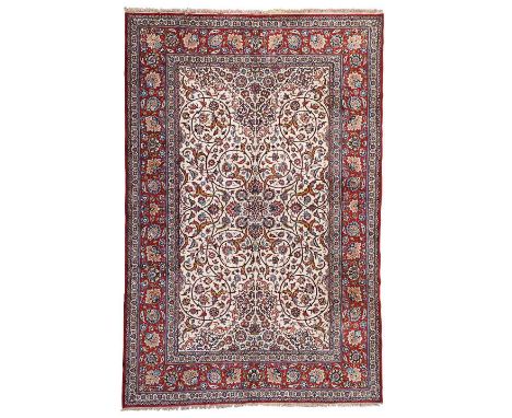 ISFAHAN PART SILK CARPET  CENTRAL PERSIA, LATE 20TH CENTURY  the cream field with small palmette medallion and overall scroll