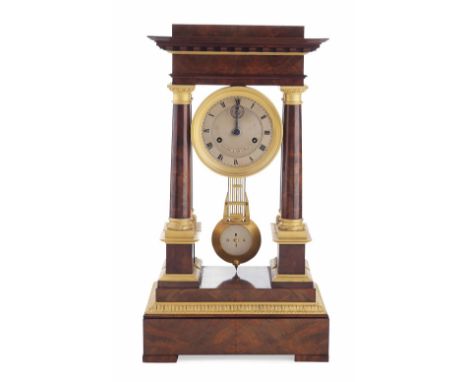 FRENCH EMPIRE MAHOGANY PORTICO CLOCK  EARLY 19TH CENTURY  the moulded pediment and frieze above four columns with gilt metal 