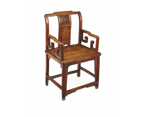 CHINESE ELM ARMCHAIR  LATE QING DYNASTY  the square back with a double panel splat carved with a stylised lotus and scroll ar