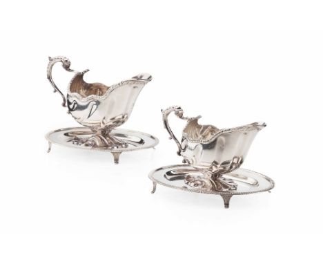 MATCHED PAIR OF GEORGIAN STYLE SILVER SAUCE BOATS AND ASSOCIATED STANDS  WILLIAM HUTTON & SONS, LONDON, 1896 & 1904  with lea