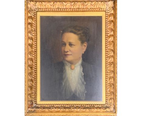 A large gilt framed oil on canvas behind glass portrait of a lady, frame size 66 x 83cm.