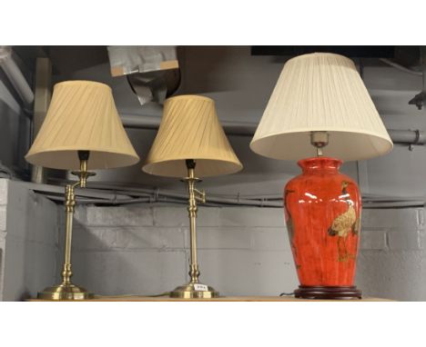 A pair of adjustable desk lamps and shades, H. 59cm. together with a ceramic table lamp and shade.