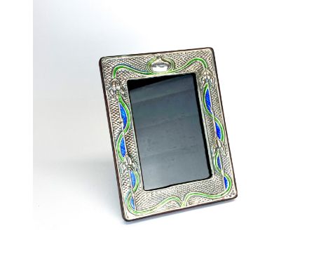 An Art Nouveau style sterling silver and enamel photo fame, 14.5 x 19cm.