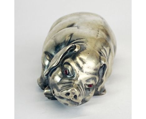 A Russian .84 silver model of a pig with cabochon ruby eyes, L. 7cm.