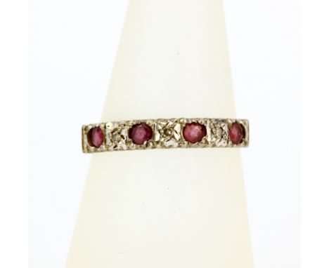 A hallmarked 9ct yellow gold ruby and diamond set ring, (N.5).