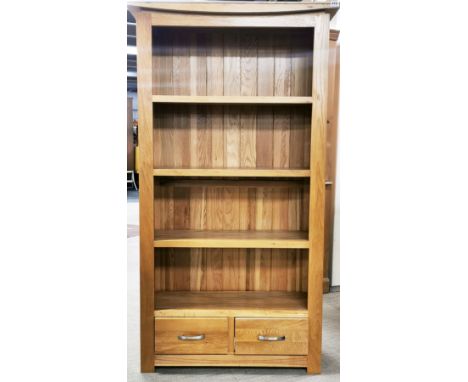 A heavy quality contemporary light oak bookcase, 99 x 179cm.