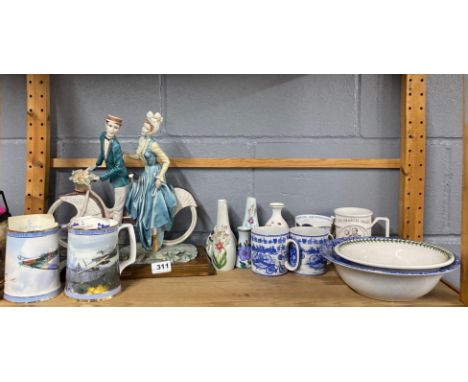 A resin figure of a couple cycling, H. 33cm. (A/F to gent's hat) with a group of ceramic items.