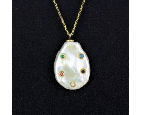 A Keshi Pearl pendant set with round cut tourmalines, a ruby and a white stone on a 925 silver gilt chain.