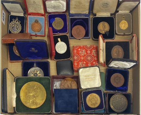A collection of mixed bronze and other commemorative medals.
