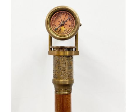 A brass telescope and compass walking stick, L. 98cm.