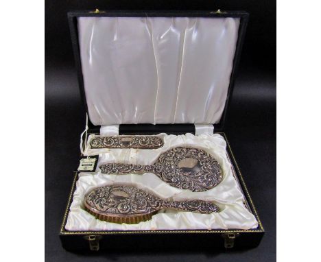 A four piece silver hair brush, mirror, clothes brush and comb set, in its original satin lined presentation box 