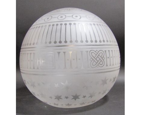 A spherical  opaque glass light shade with engraved stars and geometric patterns, 30cm diam approx 