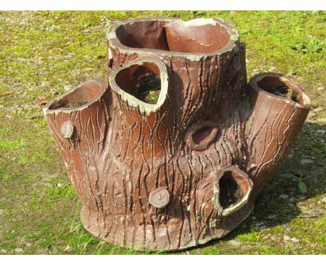 A vintage matt glazed stoneware strawberry planter in the form of a naturalistic tree stump (af), 46 cm high x approximately 