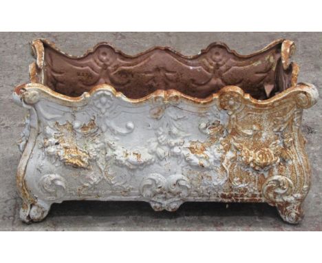 An old painted and weathered French cast iron bombe shaped planter with decorative repeating floral swag, scrolling acanthus 