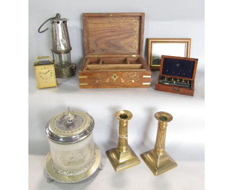 A miscellaneous collection of items including, a pair of brass column candlesticks, an Edwardian glass and silver plated bisc