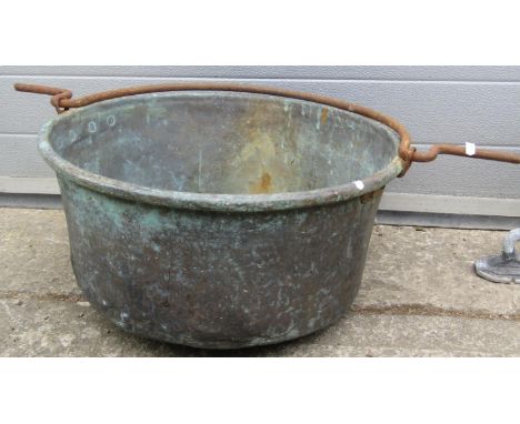 An antique weathered copper circular pan/cauldron with loose steel loop handle 55 cm diameter x 25 cm high together with a pa
