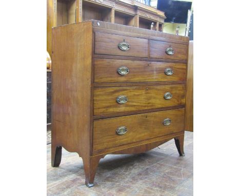 A Regency mahogany caddy top chest of three long and two short drawers with oval brass plated handles and string banded inlay