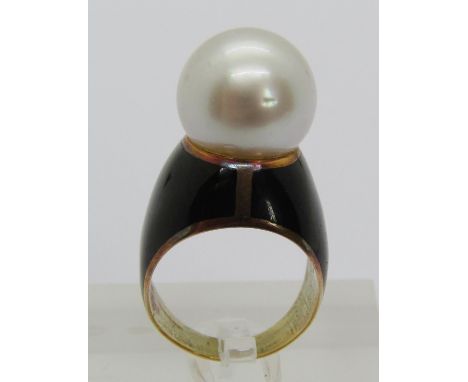 Yellow metal pearl dress ring with black enamel ground, size K/L, 11.5g 