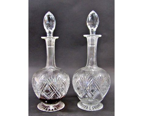 A pair of 19th century cut glass globe decanters complete with original stoppers, another small decanter with a silver sherry