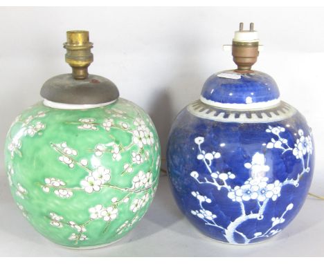Two Chines decorated ginger jar table lamps with cherry blossom decoration and a brass oil lamp base, displayed two shelves u