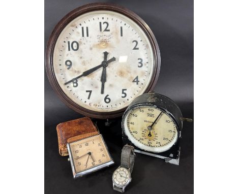 A Smith's wall or dial clock in a Bakelite case, a further Smith's timer showing seconds, a Smith's Empire wristwatch and a f