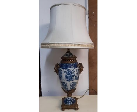 A good quality reproduction blue and white crackle glazed oviform table lamp with mask acanthus and other gilded mounts, set 
