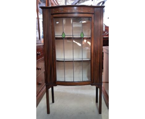 A small inlaid Edwardian mahogany display cabinet, the leaded light door with bowfront outline, 150cm high, together with a s