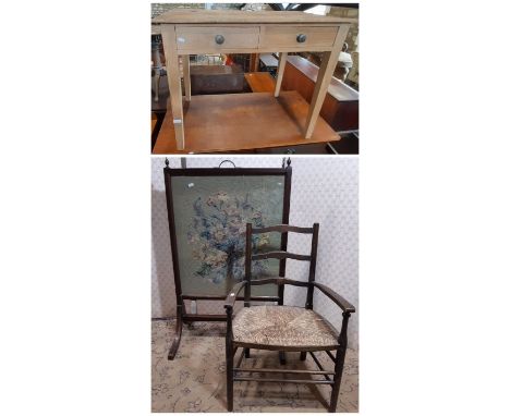 An Edwardian child's ladder back elbow chair with rush seat, and a stripped pine side table enclosing two frieze drawers on s