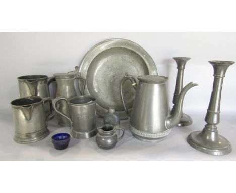 A collection of 18th and 19th century pewter ware, including a pair of candle sticks,  tankards, jugs, dish, small hip flask,