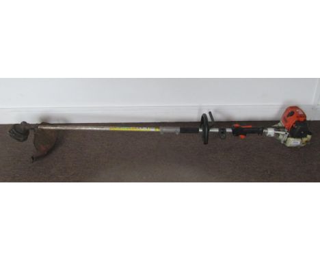 A Stihl KM100R combi multi-tool engine with line trimmer attachment 