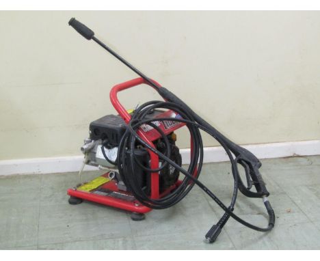 A Clarke Tiger 1700 pressure washer with 2.6hp petrol engine, max pump pressure 110 bar, max flow 6lt per minute, virtually u