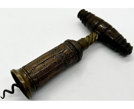 A Thamason type corkscrew, the barrel with gothic architectural detail with turned hardwood handle 