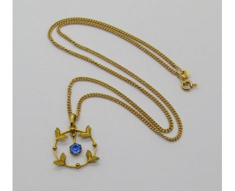 Art Nouveau style 9ct pendant set with articulated blue paste, hung from a modern 9ct chain necklace, 5.5g 