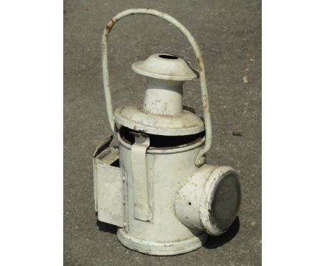 An old railway lamp with painted finish