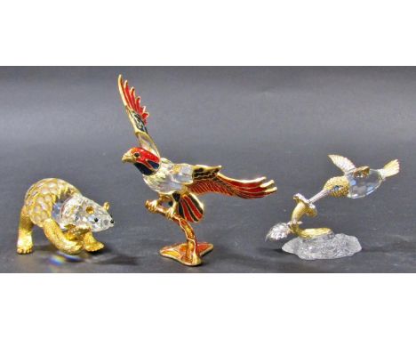 In the manner of Swarovski style/type three cut crystal animals, a bear, a hummingbird, an eagle all with gilded embellishmen