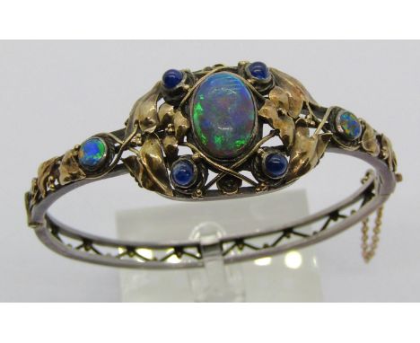 Arts &amp; Crafts opal and sapphire hinged bangle in the manner of Rhoda Wager, in unmarked white and yellow metal, centre op